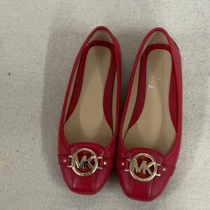 Woman’s Michael Kors slip on flat shoes
